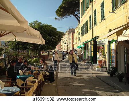 Stock Image -  Liguria, Italy, Camogli, Riviera di Levante, Ligurian Riviera, Europe, Promenade along the waterfront of the resort town of Camogli along the Ligurian Sea.. Fotosearch