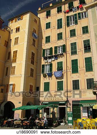 Liguria, Italy, Camogli, Riviera di Levante, Ligurian Riviera, Europe, Building with laundry hanging to dry and outdoor cafT along the waterfront of the resort town of Camogli along the Ligurian Sea. View Large Photo Image Stock Image - Liguria, Italy, Camogli, Riviera di Levante, Ligurian Riviera, Europe, Building with laundry hanging to dry and outdoor cafT along the waterfront of the resort town of Camogli along the Ligurian Sea.. Fotosearch