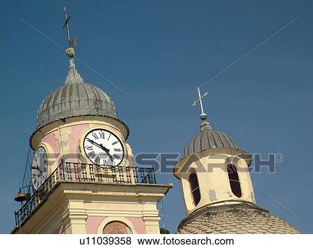 Liguria, Italy, Camogli, Riviera di Levante, Ligurian Riviera, Europe, Duomo and clock tower in the resort town of Camogli along the Ligurian Sea. View Large Photo Image Stock Photo - Liguria, Italy, Camogli, Riviera di Levante, Ligurian Riviera, Europe, Duomo and clock tower in the resort town of Camogli along the Ligurian Sea.. Fotosearch