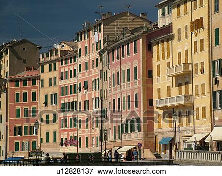 Stock Photo -  Liguria, Italy, Camogli, Riviera di Levante, Ligurian Riviera, Europe, Tall brightly painted buildings along the waterfront of the resort town of Camogli along the Ligurian Sea.. Fotosearch