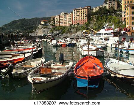Liguria, Italy, Camogli, Riviera di Levante, Ligurian Riviera, Europe, Fishing boats docked in the fishing port in the resort town of Camogli along the Ligurian Sea. View Large Photo Image Stock Photo - Liguria, Italy, Camogli, Riviera di Levante, Ligurian Riviera, Europe, Fishing boats docked in the fishing port in the resort town of Camogli along the Ligurian Sea.. Fotosearch