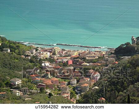 Stock Image -  Liguria, Italy, Moneglia, Riviera di Levante, Ligurian Riviera, Europe, Scenic aerial view of the town of Moneglia along the Ligurian Sea.. Fotosearch