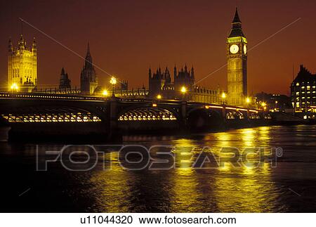 Stock Image -  London, England, Great Britain, United Kingdom, Europe, Parliament Buildings, Big Ben, and Westminster Bridge in Westminster along the River Thames in the evening. . Fotosearch