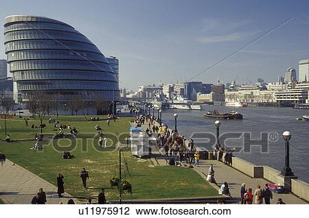 Stock Image -  London, England, Great Britain, United Kingdom, Europe, City Hall and waterfront park along the River Thames.. Fotosearch