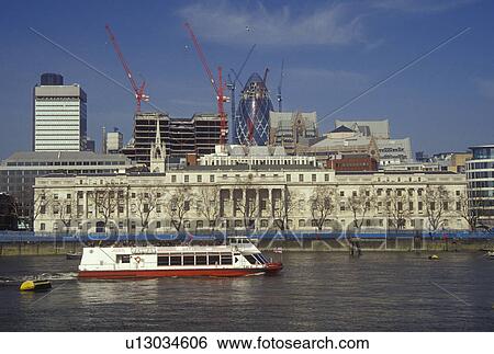 Stock Photograph -  London, England, Great Britain, United Kingdom, Europe, Sightseeing tour boat cruises past the Custom House along the River Thames.. Fotosearch