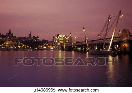London, England, Great Britain, United Kingdom, Europe, Hungerford Foot Bridge in the evening crossing the River Thames. View Large Photo Image Stock Photography - London, England, Great Britain, United Kingdom, Europe, Hungerford Foot Bridge in the evening crossing the River Thames. . Fotosearch