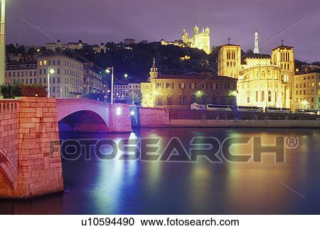 Lyon, Rhone-Alpes, France, Europe, Cathedral Saint Jean (below) and Basilique Notre Dame de Fourviere (above) illuminated at night along the Saone River in Lyon. View Large Photo Image Stock Image - Lyon, Rhone-Alpes, France, Europe, Cathedral Saint Jean (below) and Basilique Notre Dame de Fourviere (above) illuminated at night along the Saone River in Lyon.. Fotosearch