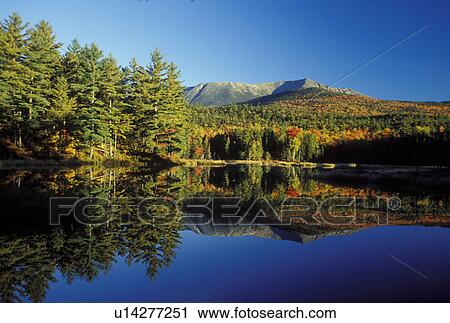 Stock Image -  ME, Maine, Baxter State Park, Scenic view of Mt. Katahdin reflecting in the calm waters of Abol Pond in Baxter State Park in the fall. . Fotosearch