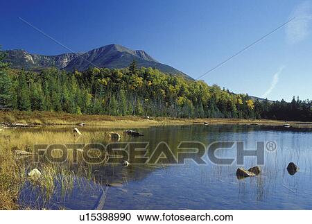 Stock Image -  ME, Maine, Baxter State Park, Scenic view of Mt. Katahdin from Tracy Pond in Baxter State Park in the fall. . Fotosearch