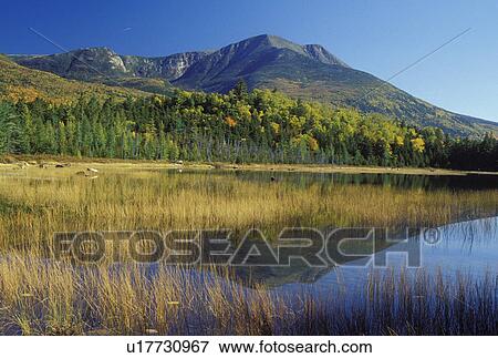 Stock Photo -  ME, Maine, Baxter State Park, Scenic view of Mt. Katahdin from Tracy Pond in Baxter State Park in the fall. . Fotosearch