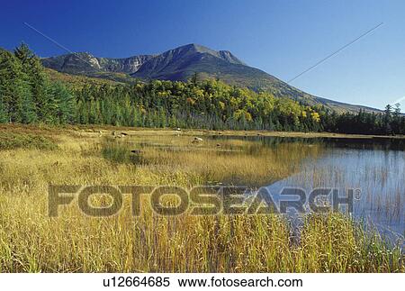 Stock Photography -  ME, Maine, Baxter State Park, Scenic view of Mt. Katahdin from Tracy Pond in Baxter State Park in the fall. . Fotosearch