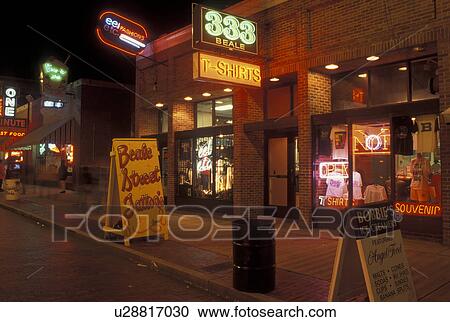 Memphis, TN, Tennessee, Blues Clubs and souvenir shops along Beale Street, evening, neon lights View Large Photo Image Stock Image - Memphis, TN, Tennessee, Blues Clubs and souvenir shops along Beale Street, evening, neon lights. Fotosearch