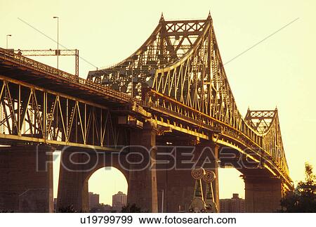 Montreal, Canada, Quebec, Pont Jacques Cartier (Jacques Cartier Bridge) at sunset crossing the St. Lawrence River (Fleuve Saint-Laurent) in Montreal. View Large Photo Image Stock Photo - Montreal, Canada, Quebec, Pont Jacques Cartier (Jacques Cartier Bridge) at sunset crossing the St. Lawrence River (Fleuve Saint-Laurent) in Montreal.. Fotosearch