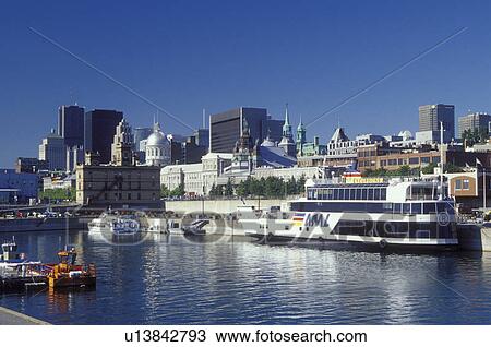 Montreal, Canada, Quebec, Vieux Port along the St. Lawrence River (Fleuve Saint-Laurent). Skyline of downtown Montreal. View Large Photo Image Stock Image - Montreal, Canada, Quebec, Vieux Port along the St. Lawrence River (Fleuve Saint-Laurent). Skyline of downtown Montreal.. Fotosearch