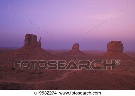 Monument Valley Navajo Tribal Park, AZ, Arizona, The Mittens Butte, sunset View Large Photo Image Picture - Monument Valley Navajo Tribal Park, AZ, Arizona, The Mittens Butte, sunset. Fotosearch