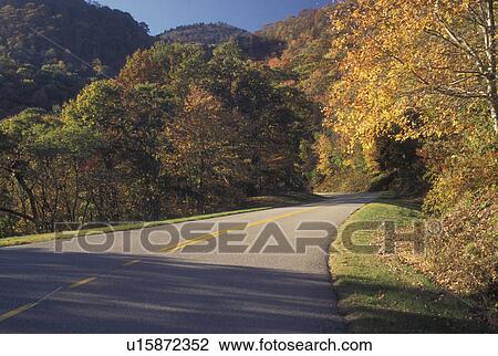 Stock Image -  NC, North Carolina, Blue Ridge Parkway, mountains, fall, road. Fotosearch