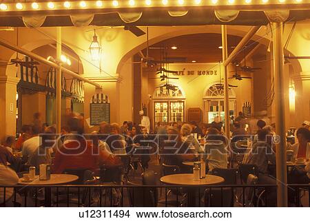 Picture -  New Orleans, LA, Louisiana, French Quarter, CafT du Monde, evening. Fotosearch