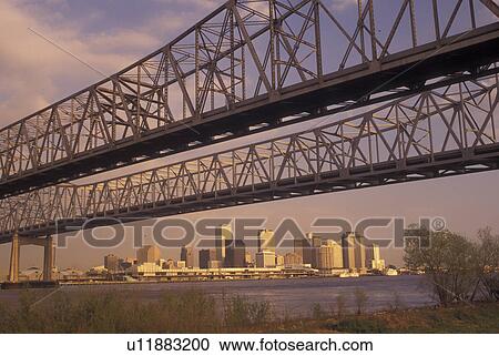 Stock Image -  New Orleans, LA, Louisiana, Mississippi River, Greater New Orleans Bridge, skyline. Fotosearch