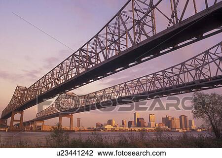 Stock Image -  New Orleans, LA, Louisiana, Mississippi River, Greater New Orleans Bridge, skyline. Fotosearch