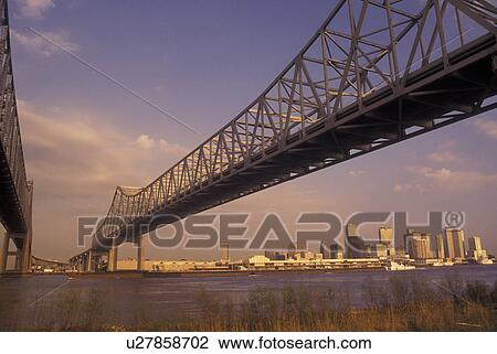 Stock Image -  New Orleans, LA, Louisiana, Mississippi River, Greater New Orleans Bridge, skyline. Fotosearch