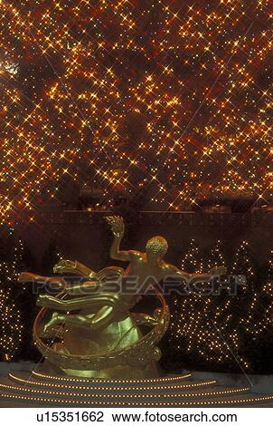 New York City, NY, New York, downtown, Rockefeller Plaza, Christmas lights, evening, statue View Large Photo Image Stock Image - New York City, NY, New York, downtown, Rockefeller Plaza, Christmas lights, evening, statue. Fotosearch