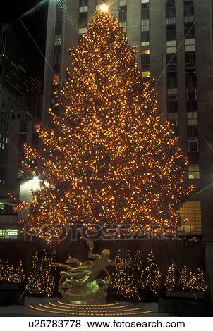Stock Photo -  New York City, NY, New York, downtown, Rockefeller Plaza, Christmas Tree, lights, evening. Fotosearch