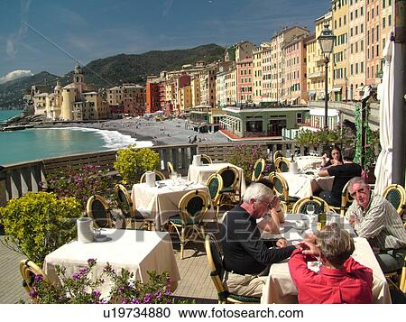 Stock Image -  outdoor cafT, Camogli, Liguria, Italy, Riviera di Levante, Ligurian Riviera, Europe, Outdoor cafT along the waterfront of the resort town of Camogli along the Ligurian Sea.. Fotosearch