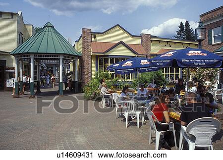 Stock Image -  outdoor cafT, Canada, Quebec, Laurentians, Saint-Jovite, Outdoor cafT in downtown Saint-Jovite.. Fotosearch