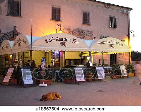 outdoor cafT, Italy, Lazio, Tarquinia, Europe, Outdoor restaurant in the medieval centre of Tarquinia in the evening. View Large Photo Image Picture - outdoor cafT, Italy, Lazio, Tarquinia, Europe, Outdoor restaurant in the medieval centre of Tarquinia in the evening.. Fotosearch