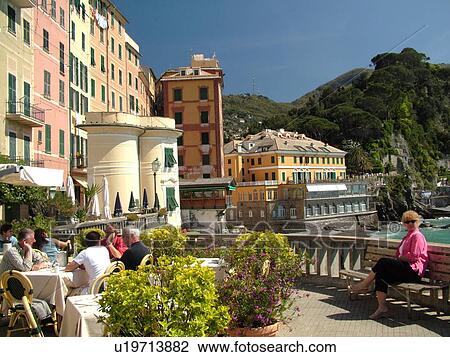Stock Image -  outdoor cafT, Italy, Liguria, Camogli, Riviera di Levante, Ligurian Riviera, Europe, Outdoor cafT along the waterfront of the resort town of Camogli along the Ligurian Sea.. Fotosearch
