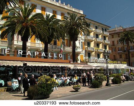 Stock Image -  outdoor cafT, Italy, Rapallo, Riviera di Levante, Liguria, Ligurian Riviera, Europe, Gran Caffe Rapallo along the waterfront in the resort town of Rapallo along the Ligurian Sea.. Fotosearch