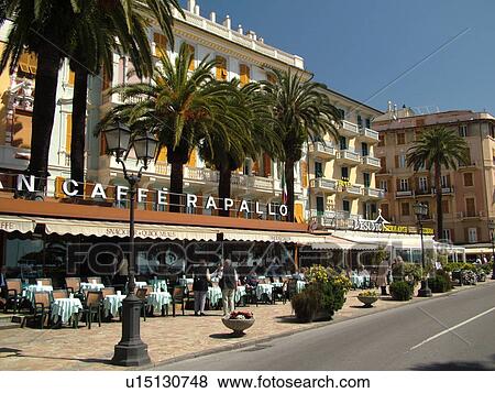 Stock Photo -  outdoor cafT, Liguria, Italy, Rapallo, Riviera di Levante, Ligurian Riviera, Europe, Gran Caffe Rapallo along the waterfront in the resort town of Rapallo along the Ligurian Sea.. Fotosearch