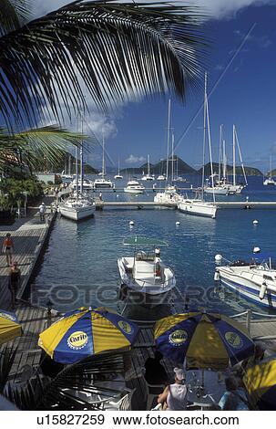 Stock Photo -  outdoor cafT, Tortola, British Virgin Islands, West End, Caribbean, BVI, Sopers Hole, Pusser's Landing on the waterfront of Frenchman's Cay on the island of Tortola.. Fotosearch