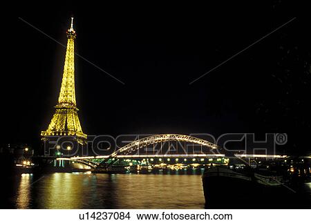 Paris, Ile de France, France, Europe, Eiffel Tower along the Seine River in the city of Paris in the evening. View Large Photo Image Picture - Paris, Ile de France, France, Europe, Eiffel Tower along the Seine River in the city of Paris in the evening.. Fotosearch