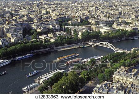 Paris, Ile de France, France, Europe, Aerial view of the city of Paris and the Seine River looking North from the Eiffel Tower. View Large Photo Image Stock Image - Paris, Ile de France, France, Europe, Aerial view of the city of Paris and the Seine River looking North from the Eiffel Tower.. Fotosearch