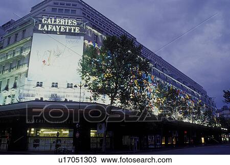 Stock Image -  Paris, Ile de France, France, Europe, Galleries Lafayette in Paris in the evening. . Fotosearch