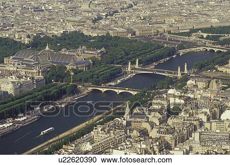 Stock Image -  Paris, Ile de France, France, Europe, Aerial view of the city of Paris and the Grand Palais along the Seine River looking Northeast from the Eiffel Tower.. Fotosearch
