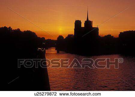 Paris, Ile de France, France, Europe, Silhouette of the Notre Dame Cathedrale at sunset along the Seine River in Paris. View Large Photo Image Stock Image - Paris, Ile de France, France, Europe, Silhouette of the Notre Dame Cathedrale at sunset along the Seine River in Paris.. Fotosearch