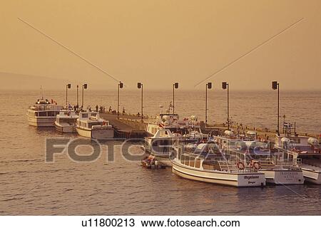 Perce. Gaspe Peninsula, Quebec, Canada, Gulf of St. Lawrence, Excursion boats docked at a marina along the Gulf of St. Lawrence in Perce on the Gaspe Peninsula. View Large Photo Image Stock Image - Perce. Gaspe Peninsula, Quebec, Canada, Gulf of St. Lawrence, Excursion boats docked at a marina along the Gulf of St. Lawrence in Perce on the Gaspe Peninsula.. Fotosearch