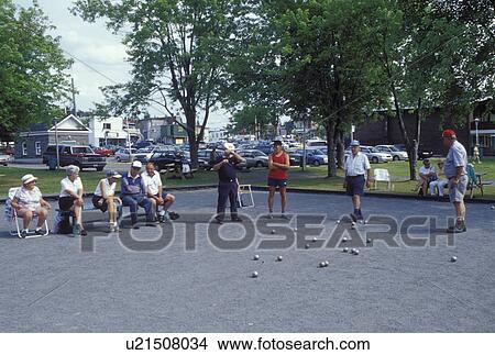 Picture -  petanque, Canada, Quebec, Laurentians, Ste. Agathe des Monts, People playing a game of Petanque in a city park in Ste-Agathe-des-Monts.. Fotosearch
