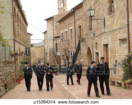 policemen, Italy, Tuscany, Sovana, Toscana, Europe, Italian Carabinieri walking through the medieval town of Sovana. View Large Photo Image Picture - policemen, Italy, Tuscany, Sovana, Toscana, Europe, Italian Carabinieri walking through the medieval town of Sovana.. Fotosearch