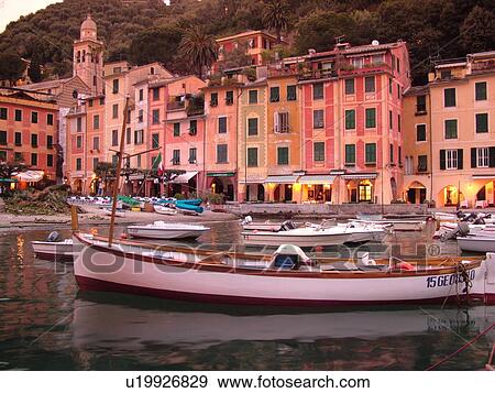Portofino, Italy, Riviera di Levante, Ligurian Riviera, Liguria, Europe, Boats in the harbor of the resort town of Portofino at sunset along the Ligurian Sea. View Large Photo Image Stock Photo - Portofino, Italy, Riviera di Levante, Ligurian Riviera, Liguria, Europe, Boats in the harbor of the resort town of Portofino at sunset along the Ligurian Sea.. Fotosearch