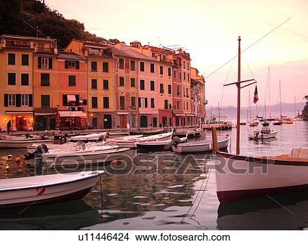 Portofino, Liguria, Italy, Riviera di Levante, Ligurian Riviera, Europe, Boats in the harbor of the resort town of Portofino at sunset along the Ligurian Sea. View Large Photo Image Picture - Portofino, Liguria, Italy, Riviera di Levante, Ligurian Riviera, Europe, Boats in the harbor of the resort town of Portofino at sunset along the Ligurian Sea.. Fotosearch