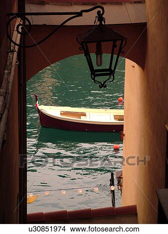 Picture -  Portofino, Liguria, Italy, Riviera di Levante, Ligurian Riviera, Europe, Fishing boat in the harbor of the resort town of Portofino along the Ligurian Sea.. Fotosearch