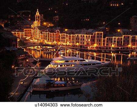 Portofino, Liguria, Italy, Riviera di Levante, Ligurian Riviera, Europe, Buildings illuminated at night along the waterfront of the resort town of Portofino on the Ligurian Sea. View Large Photo Image Stock Image - Portofino, Liguria, Italy, Riviera di Levante, Ligurian Riviera, Europe, Buildings illuminated at night along the waterfront of the resort town of Portofino on the Ligurian Sea.. Fotosearch
