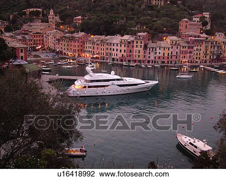 Portofino, Liguria, Italy, Riviera di Levante, Ligurian Riviera, Europe, Scenic view of the harbor of the resort town of Portofino in the evening along the Ligurian Sea. View Large Photo Image Stock Image - Portofino, Liguria, Italy, Riviera di Levante, Ligurian Riviera, Europe, Scenic view of the harbor of the resort town of Portofino in the evening along the Ligurian Sea.. Fotosearch