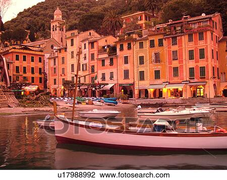 Portofino, Liguria, Italy, Riviera di Levante, Ligurian Riviera, Europe, Boats in the harbor of the resort town of Portofino at sunset along the Ligurian Sea. View Large Photo Image Stock Image - Portofino, Liguria, Italy, Riviera di Levante, Ligurian Riviera, Europe, Boats in the harbor of the resort town of Portofino at sunset along the Ligurian Sea.. Fotosearch
