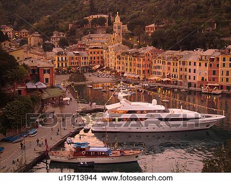 Portofino, Riviera di Levante, Liguria, Italy, Ligurian Riviera, Europe, Scenic view of the harbor and resort town of Portofino in the evening along the Ligurian Sea. View Large Photo Image Picture - Portofino, Riviera di Levante, Liguria, Italy, Ligurian Riviera, Europe, Scenic view of the harbor and resort town of Portofino in the evening along the Ligurian Sea.. Fotosearch
