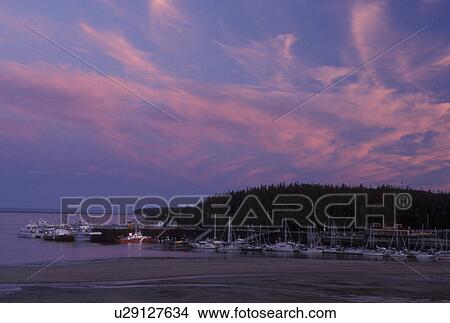 Quebec, Canada, Tadoussac, Marina on the St. Lawrence (Fleuve Saint-Laurent) and Saguenay Rivers at sunset in the summer resort town of Tadoussac. View Large Photo Image Picture - Quebec, Canada, Tadoussac, Marina on the St. Lawrence (Fleuve Saint-Laurent) and Saguenay Rivers at sunset in the summer resort town of Tadoussac.. Fotosearch