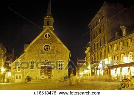 Stock Photograph -  Quebec City, Canada, Quebec, Notre Dames des Victoires Church at Place Royale in the evening in Vieux Quebec (Old Quebec).. Fotosearch